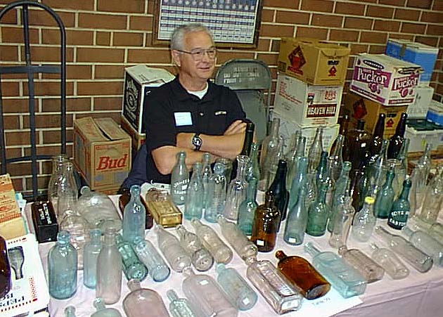 Ronald Hinsley greeting people at his sales table: