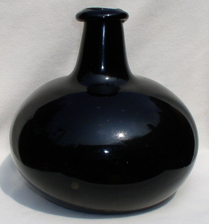 Black glass bottle - unusual form.